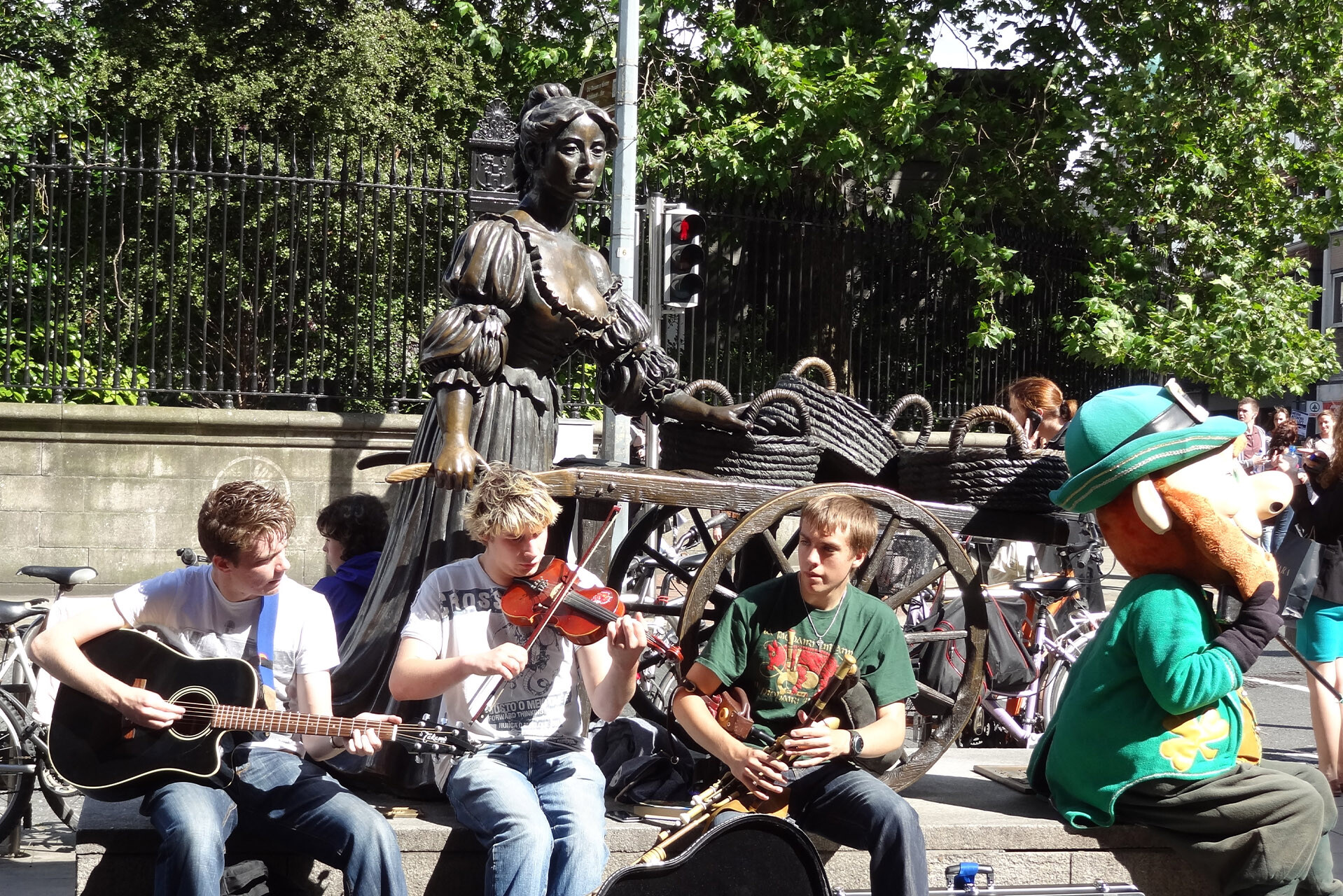 Dublin, Ireland. Irish boys busking beside the Molly Malone statue